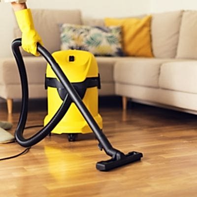 woman-cleaning-sofa-with-yellow-vacuum-cleaner-copy-space-cleaning-service-concept-1.jpg